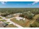 Aerial view of a single-Gathering home with a large backyard and detached shed at 6104 Plamendon Ave, North Port, FL 34291