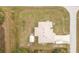 Aerial view of a single-Gathering home with a detached shed and boat storage at 6104 Plamendon Ave, North Port, FL 34291