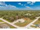 Single-story house with a large lot, aerial view at 6104 Plamendon Ave, North Port, FL 34291