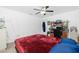 Bedroom with a double bed, ceiling fan, and workspace at 6104 Plamendon Ave, North Port, FL 34291