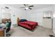 Bedroom with a double bed, ceiling fan, and en-suite bathroom at 6104 Plamendon Ave, North Port, FL 34291