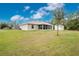 House exterior showcasing backyard, shed, and landscaping at 6104 Plamendon Ave, North Port, FL 34291