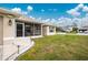 House exterior showcasing side yard and walkway lighting at 6104 Plamendon Ave, North Port, FL 34291