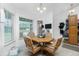 Kitchen nook features a hexagonal table with built-in seating and a view to the backyard at 6104 Plamendon Ave, North Port, FL 34291