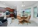 Kitchen with breakfast nook and dark brown cabinets at 6104 Plamendon Ave, North Port, FL 34291