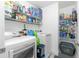 Laundry room with washer, dryer, and ample storage shelving at 6104 Plamendon Ave, North Port, FL 34291