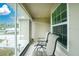 Enclosed porch with seating and a view of the front yard at 6104 Plamendon Ave, North Port, FL 34291