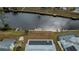 Aerial view showing home, dock, and canal at 6365 Scorpio Ave, North Port, FL 34287