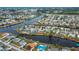 Aerial view showcasing home's location and canal access at 6365 Scorpio Ave, North Port, FL 34287