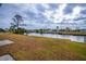 Spacious backyard with canal view and lush grass at 6365 Scorpio Ave, North Port, FL 34287