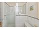 Bathroom with white tiled walls and shower stall at 6365 Scorpio Ave, North Port, FL 34287