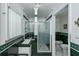 Bathroom with shower and green tiled walls at 6365 Scorpio Ave, North Port, FL 34287