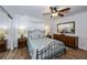 Bright bedroom with a metal bed frame and wood dresser at 6365 Scorpio Ave, North Port, FL 34287