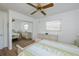 Bedroom with mirrored closet doors and wicker furniture at 6365 Scorpio Ave, North Port, FL 34287