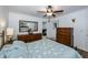 Guest bedroom with dresser and ensuite bathroom at 6365 Scorpio Ave, North Port, FL 34287