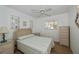 Bedroom with wicker furniture, ceiling fan, and window at 6365 Scorpio Ave, North Port, FL 34287
