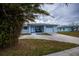 Newly renovated home with a light blue exterior at 6365 Scorpio Ave, North Port, FL 34287