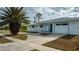 Ranch-style home with a carport and mature landscaping at 6365 Scorpio Ave, North Port, FL 34287