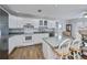 White kitchen with stainless steel appliances and island at 6365 Scorpio Ave, North Port, FL 34287