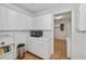 Bright kitchen with white cabinets and built-in microwave at 6365 Scorpio Ave, North Port, FL 34287