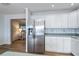Stainless steel refrigerator in white kitchen at 6365 Scorpio Ave, North Port, FL 34287