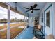 Screened porch with canal view and comfy seating at 6365 Scorpio Ave, North Port, FL 34287