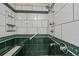 Walk-in shower with tiled walls and built-in seat at 6365 Scorpio Ave, North Port, FL 34287