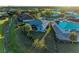 Aerial view showing house, pool, and surrounding neighborhood at 7342 N Ficus Tree, Punta Gorda, FL 33955