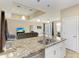 Kitchen island with double sink overlooking the living room at 7342 N Ficus Tree, Punta Gorda, FL 33955