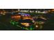 Night aerial view of house and neighborhood; showcasing landscape lighting at 7424 S Moss Rose, Punta Gorda, FL 33955