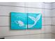 Charming mermaid-themed artwork adorns the bathroom wall at 7424 S Moss Rose, Punta Gorda, FL 33955