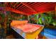 Relaxing hot tub under a wooden pergola with colorful lighting at 7424 S Moss Rose, Punta Gorda, FL 33955