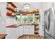 Kitchen corner with white cabinets, wood countertop, and window seat at 7424 S Moss Rose, Punta Gorda, FL 33955