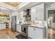 Modern kitchen featuring stainless steel appliances and white shaker cabinets at 7424 S Moss Rose, Punta Gorda, FL 33955