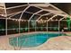 Enclosed pool area with string lights at night at 7424 S Moss Rose, Punta Gorda, FL 33955