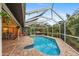 Inviting pool and spa with screened enclosure and patio at 7424 S Moss Rose, Punta Gorda, FL 33955