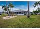 Spacious backyard with lush lawn and canal views at 760 Bal Harbor Blvd, Punta Gorda, FL 33950