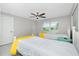 Bright bedroom with two twin beds, ceiling fan, and window at 760 Bal Harbor Blvd, Punta Gorda, FL 33950