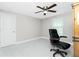 Bright bedroom with ceiling fan, window coverings, and an office chair at 760 Bal Harbor Blvd, Punta Gorda, FL 33950