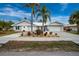 House exterior with white walls and palm trees at 760 Bal Harbor Blvd, Punta Gorda, FL 33950