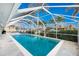 Inviting screened pool area with lounge chairs, offering water views at 760 Bal Harbor Blvd, Punta Gorda, FL 33950