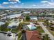 An aerial view of a canal front home with a large pool and spacious backyard at 840 Via Tunis, Punta Gorda, FL 33950