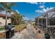 Brick walkway leads to pool area and canal views at 840 Via Tunis, Punta Gorda, FL 33950