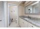 Bathroom with granite countertop, vanity, and shower at 840 Via Tunis, Punta Gorda, FL 33950