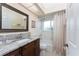 Bathroom with shower/tub combo, granite vanity, and beige walls at 840 Via Tunis, Punta Gorda, FL 33950