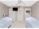 Twin bedroom with white beds and ceiling fan at 840 Via Tunis, Punta Gorda, FL 33950