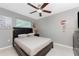 Bedroom with double bed, ceiling fan, and window at 840 Via Tunis, Punta Gorda, FL 33950