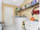 Laundry room with washer, dryer, and utility sink at 840 Via Tunis, Punta Gorda, FL 33950