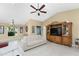 Bright living room features vaulted ceilings, a ceiling fan, and a neutral color palette at 840 Via Tunis, Punta Gorda, FL 33950