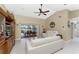 Living Room with vaulted ceiling, white sofas, and access to patio and canal at 840 Via Tunis, Punta Gorda, FL 33950